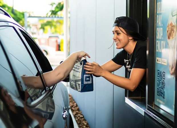 A Woman Giving the Order in Drive Thru — Greek Restaurant in Morayfield, QLD